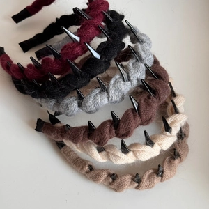 Knitted twist headbands with punk spikes in various colors for a high-crown winter look