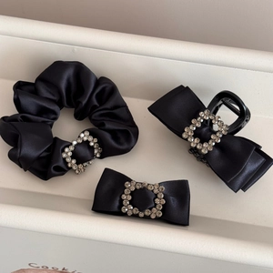 Black satin hair accessory set with square rhinestone buckles and bow design