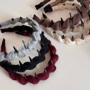 Knitted braided headband with punk spikes in multiple earth tones for autumn and winter