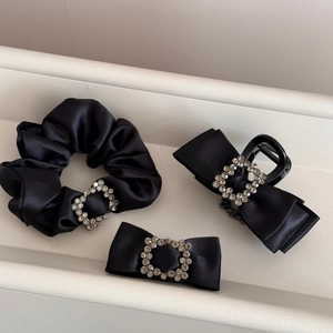 Detailed set of black satin hair accessories with sparkling rectangular rhinestones