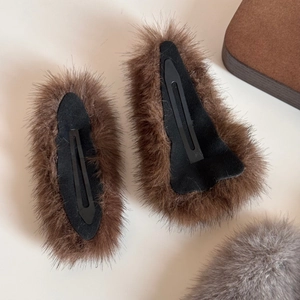 Close-up of two brown plush faux fur hair clips with high quality metallic BB clip base