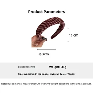 Detail view of a padded red-brown plaid headband showing 13.5cm width and 16cm height