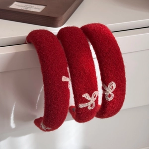 Elegant red plush headband with white butterfly embroidery for winter fashion styling