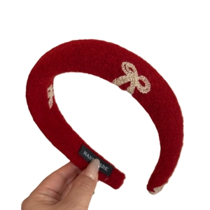 Padded red headband with elegant bow embroidery for high cranium visual effect