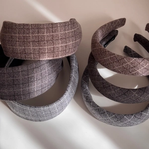 Close-up of handmade thick fabric headbands featuring plaid and checkered patterns