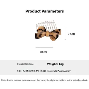 Macro detail of acetate leopard bow hair comb with size measurements 8x7cm