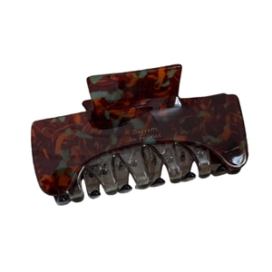 Rectangular acetate hair claw clip with brown marble pattern and durable gold spring