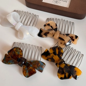 Elegant acetate bow hair combs with tortoise shell patterns and metal base pins