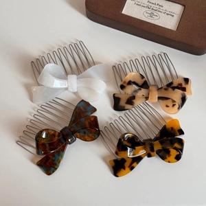 Acetate bow hair side combs set in pearl white and tortoiseshell patterns for women