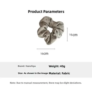 Detail view of a 15cm vintage floral scrunchie in beige grey fabric weighing 40g