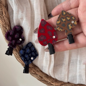 Set of four leopard print playing card suit hair clips with velvet texture and rhinestones