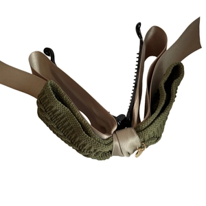 Elegant double-layered dark green woven bow banana hair clip with a golden charm