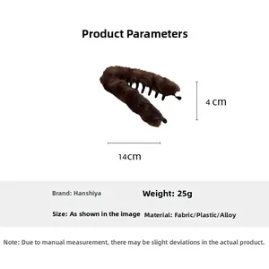 Pince banane en peluche marron montrant les dimensions de 14 cm et un poids de 25 g