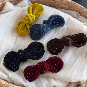 Detailed set of five velvet polka dot bow hair clips in assorted elegant autumn colors