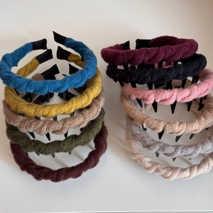 Set of ten colorful knitted twist headbands with anti-slip teeth for secure styling