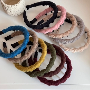 Chic twisted knit headbands in assorted colors with non-slip teeth for secure styling