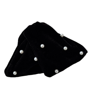 Elegant black velvet hair clip with pearl embellishments for sophisticated updos