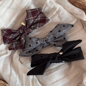 Three elegant Korean-style fabric bow hair clips in plaid, heart print, and black dot patterns