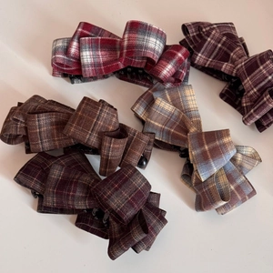 Elegant checkered fabric bow hair clips in multiple colors with woven texture details