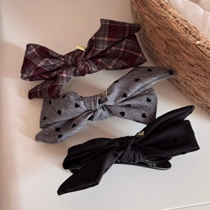 Three-piece set of elegant bow hair clips in plaid and polka dot fabric textures