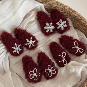 Winter plush floral hair clips in deep red with pearls and rhinestones on woven fabric