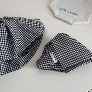 Chic black and white checkered sun hat and matching accessory bag with Happiness label