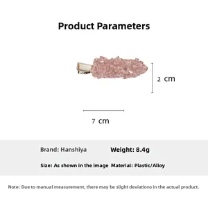 Detailed view of pink crystal hair clip with dimensions of seven cm length and two cm width