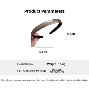 Detail view of a slim faux leather headband with size and weight dimensions
