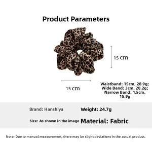 Detailed view of leopard print scrunchie showing 15cm outer diameter and 24.7g weight