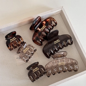 6-piece French style square hair claws set with gold lettering in tortoise and amber shades