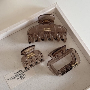 Three-piece set of translucent coffee resin hair claws with golden letter detailing