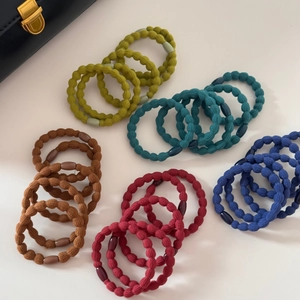 Set di 5 elastici per capelli testurizzati dai colori vivaci come senape, blu e bordeaux