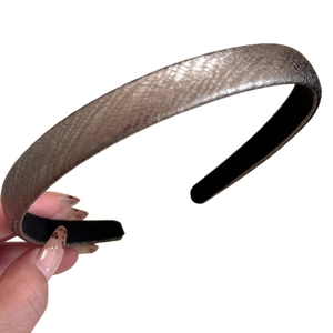 Silver snakeskin textured narrow headband with metallic finish and black non-slip lining