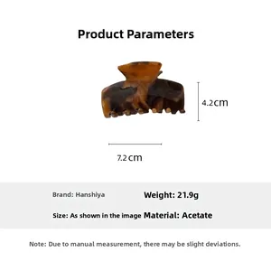 Macro view of acetate hair claw showing dimensions 7.2cm length and brown marble texture