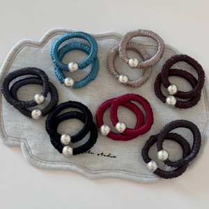 Detailed set of 14 pleated elastic hair ties with silver beads in seven various colors