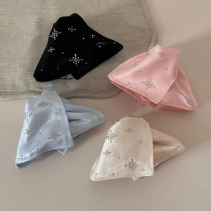 Detail view of four satin bow hair claws with star rhinestone patterns in various colors