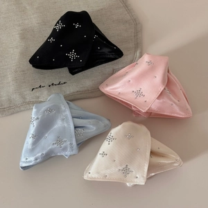 Detail of satin bow hair clips with rhinestone star patterns in four elegant colors