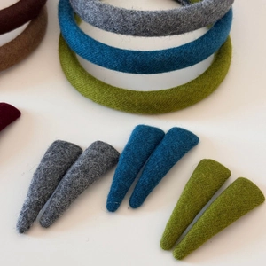 Detailed close-up showing soft wool fabric texture and colors of elegant hairbands