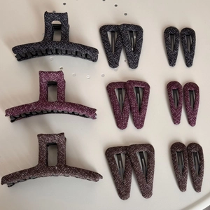 Flat lay of wool tweed hair accessory set including shark clips and side barrettes