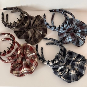 Detailed view of handmade checkered hairbands featuring four distinct fabric color patterns