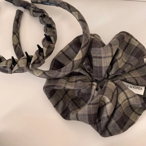 Close-up of brown plaid fabric headband and large scrunchie with handmade details