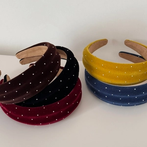 Close-up of velvet sponge headbands with starry rhinestone detail in various colors