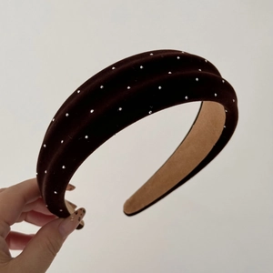 Detail of deep brown velvet headband with sparkling silver rhinestones and non-slip lining