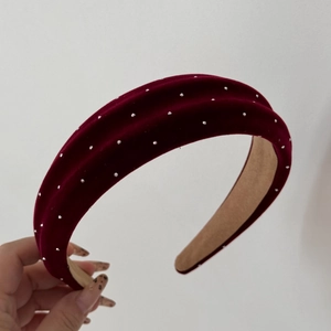 Close-up of velvet headband with silver rhinestones in deep burgundy wine red