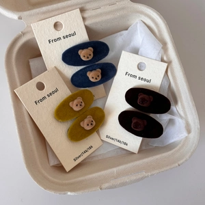 Detail of cute flocking bear hair clips in navy blue, ginger and deep coffee colors