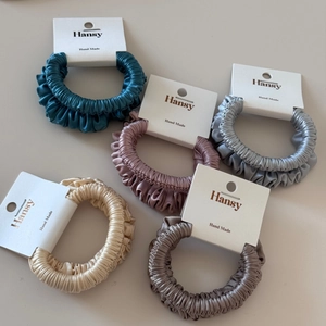 Set of five elegant silk satin hair scrunchies in assorted earthy colors with soft texture