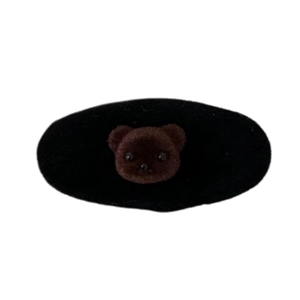 Cute black flocked oval hair clip featuring a brown plush bear head for girls