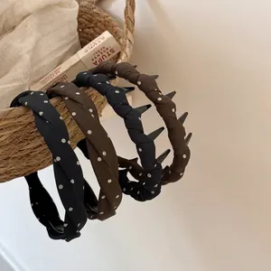 Polka dot twisted headbands in navy and coffee brown with non-slip teeth for women