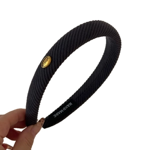 Handmade dark grey ribbed fabric headband with oval gold KOREA metal plate detail