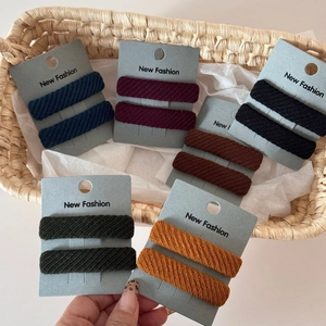 Detailed view of 12 piece twill fabric sponge BB hair clips in six classic earthy colors